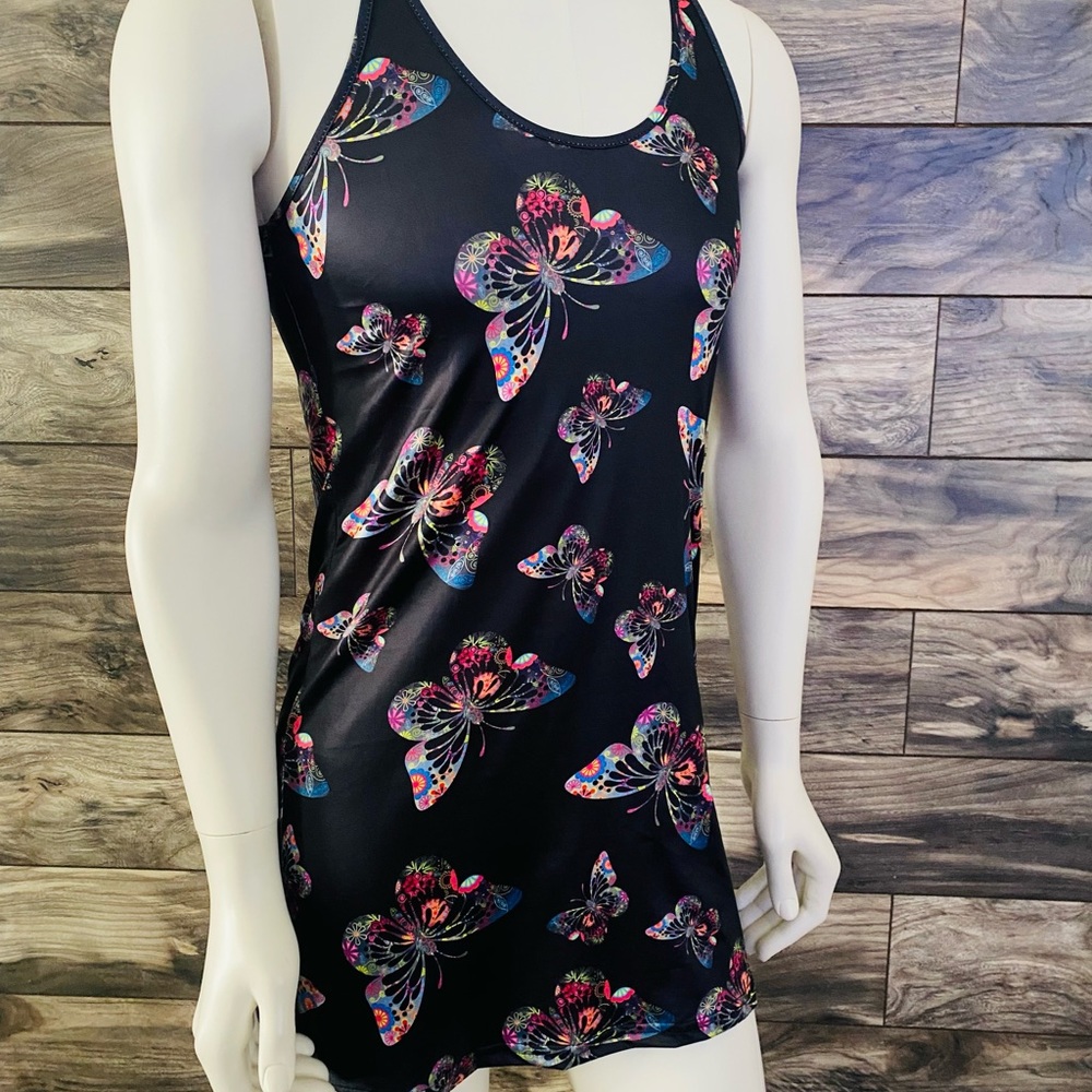 NWOT Black dress with colorful butterflies. Back has a weaved plunge design.